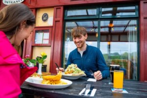 a couple eating outside the best in Irish food