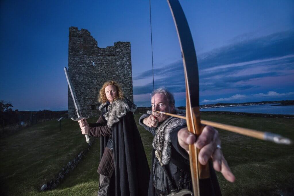 two men with bows game of thrones studio tour