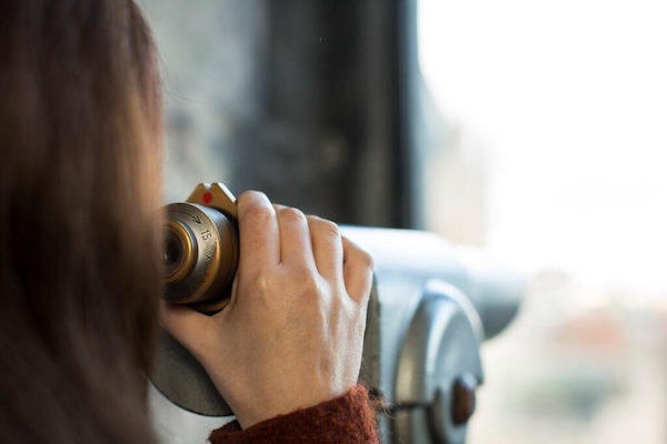 a person looking through a binocular viewer 7 historical attractions in Dublin