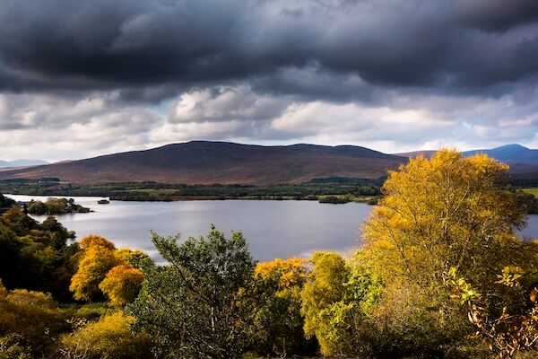 a lake with mountains in the background visiting Ireland's national parks