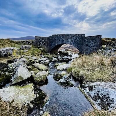 a bridge over a river visiting Ireland's national parks