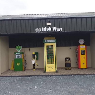 a telephone box and petrol pumps Old Irish Ways