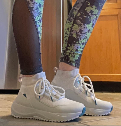 a pair of shoes on a person Vessi shoes