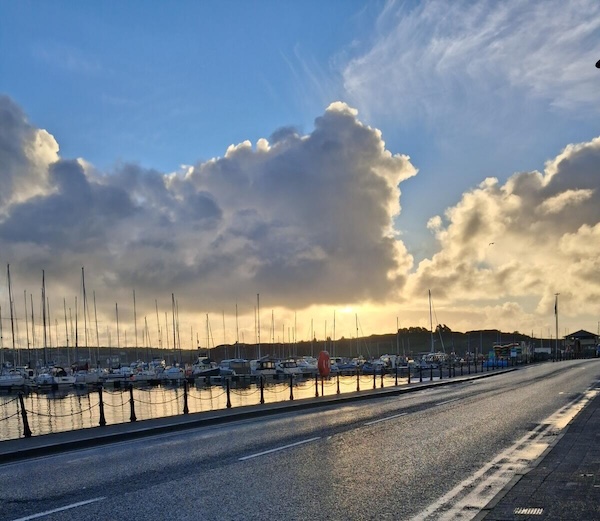 clouds over a harbor or October in Ireland