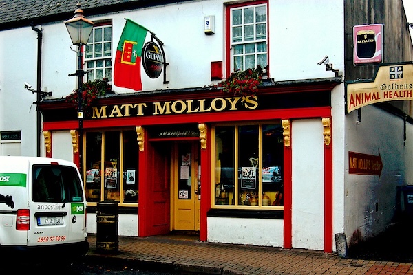 a pub with a flag above the door January in Ireland