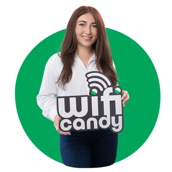 a woman holding a sign WiFi access for tourists