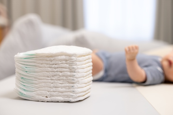a stack of diapers traveling to Ireland with young children