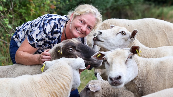 a woman with goats green door tours