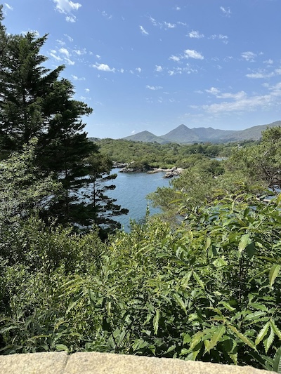 a lake with mountains in the background meet Mary G