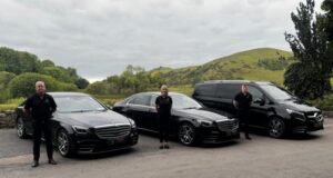 three people standing by cars the smarter way to see Ireland