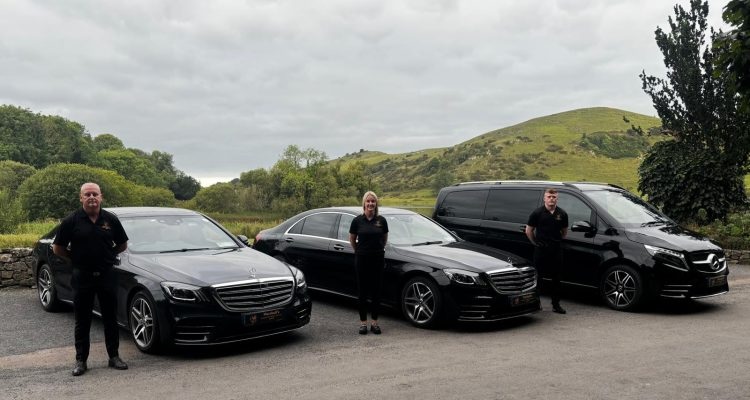three people standing by cars the smarter way to see Ireland