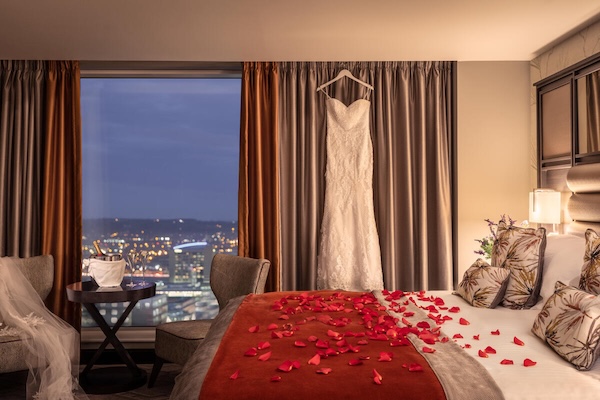 a wedding dress hanging up in a hotel room the Ireland travel business network