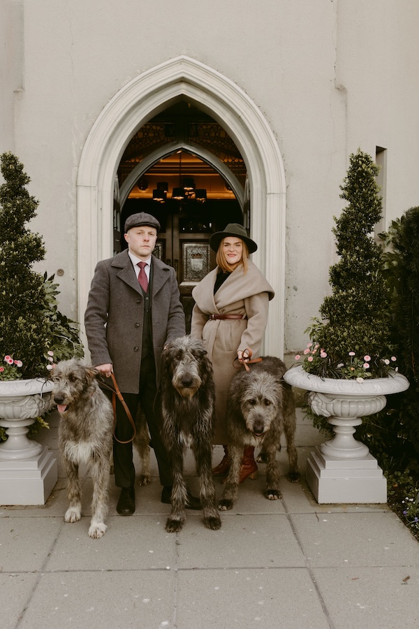two people with dogs Irish wolfhound experience in Ireland
