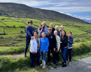 a group of people standing in the countryside Robbie's Luxury Travel