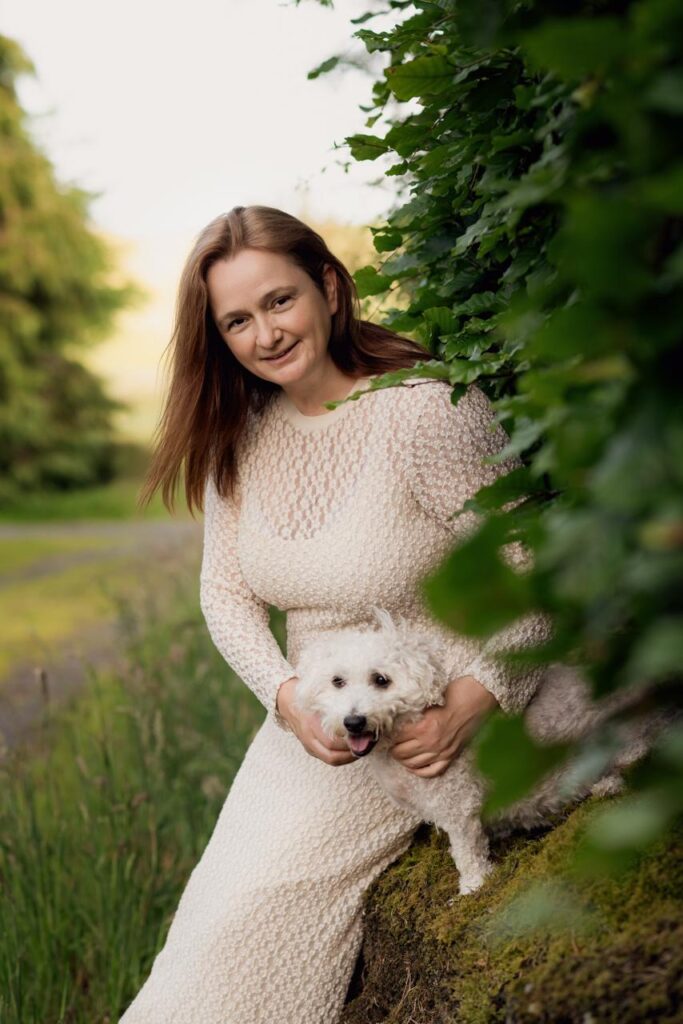 a woman with a dog The Ireland Travel Business Network List